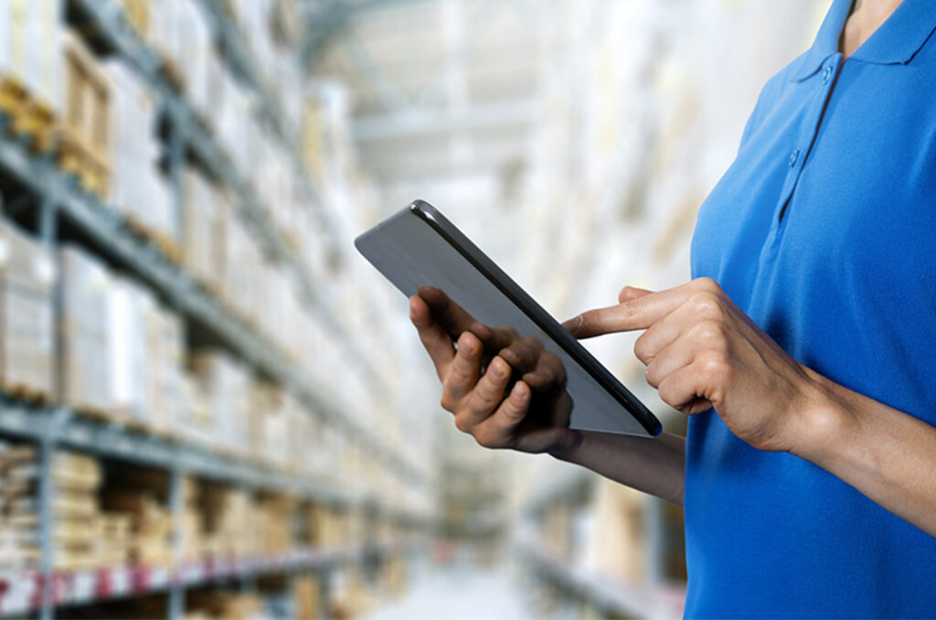 Woman holding tablet in warehouse