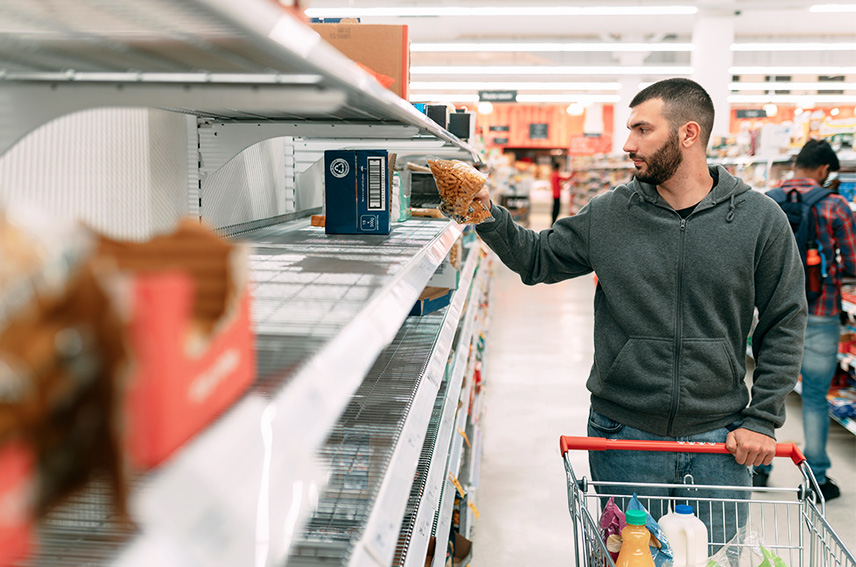 Man at grocery store that has items out of stock