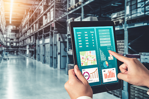 Person operating digital tablet in warehouse