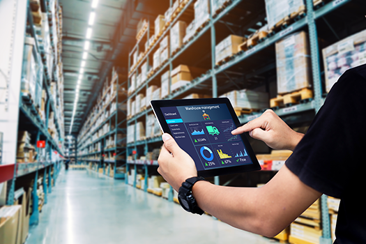Warehouse worker looking at tablet