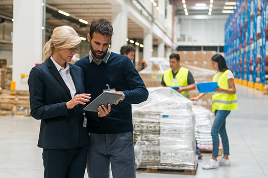 man and woman working in warehouse