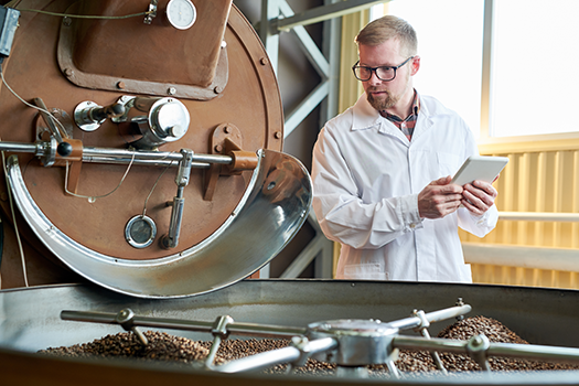man working on coffee production
