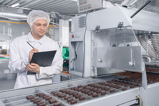 man working in chocolate factory