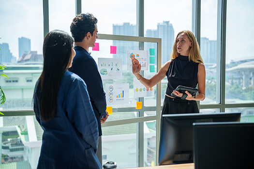 three coworkers having a meeting in office