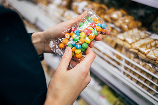 shopper looking at candy in store